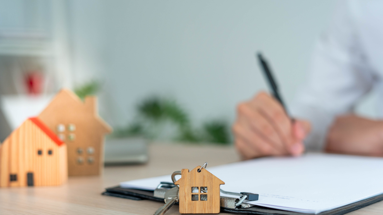 man filling out purchase paperwork for a home in edmonton